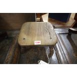 A 19th century ash milking stool, possibly Yorkshire, 22.5cm wide.