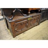 An 18th century oak coffer, 120cm wide.