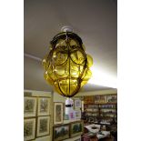A vintage amber glass ceiling shade.