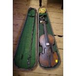 An antique Continental violin, labelled 'Antonius Stradivarius...', with 14in back, with bow and