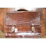 A vintage crocodile skin attache case.