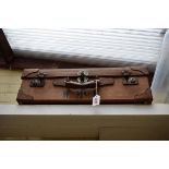 A vintage tan leather suitcase, 57cm wide.