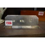 An Art Deco silver mounted desk calendar, 17cm wide.