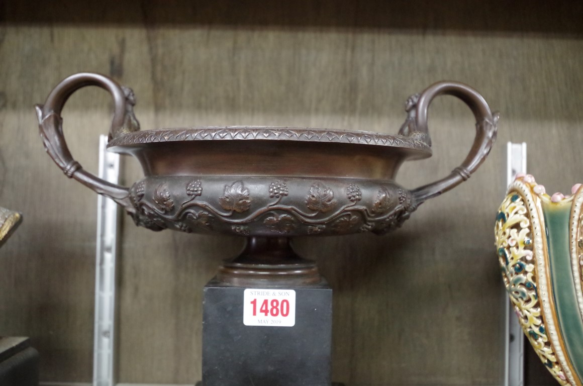 A 19th century bronze twin handled campana urn, on slate base, 32cm wide. - Image 2 of 4