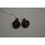 Two small patinated metal animal bells, possibly Medieval.