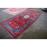 A Persian carpet,Â having floral central medallion with allover floral design with a geometric