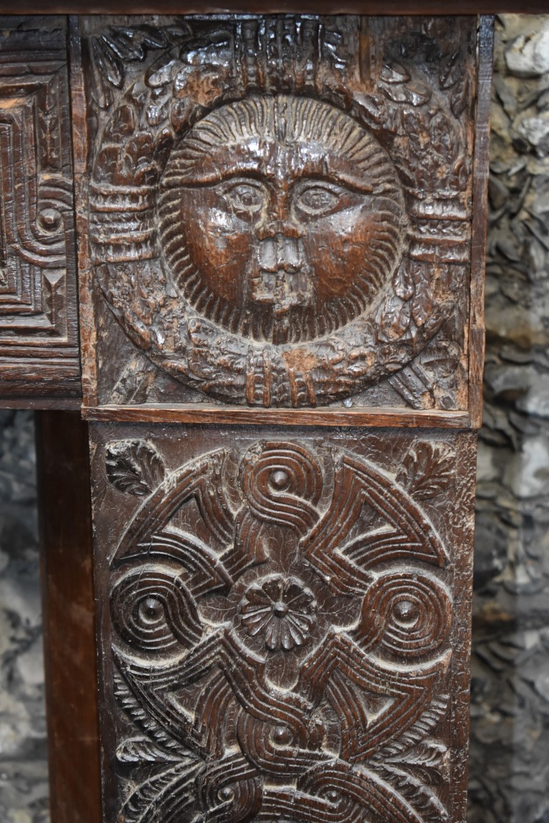 An interesting French carved oak fire surround, containing 16th/17th century elements, the frieze - Image 2 of 3