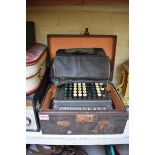 A vintage 'London Computator Corporation' adding machine, boxed.