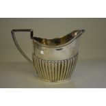 A silver Queen Anne style cream jug, by Walker & Hall, Sheffield 1894, 10.5cm, 178g.