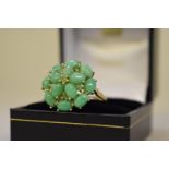 A jade cluster gold ring,Â hallmarked 375.