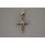 A diamond set gold cross pendant,Â stamped 18k.