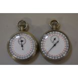 Two vintage military T.P 1/10 stopwatches.