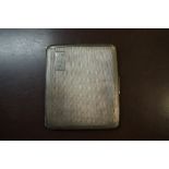 An engine turned silver cigarette case, 138g.