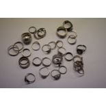 A quantity of silver and metal rings, 81g all in.