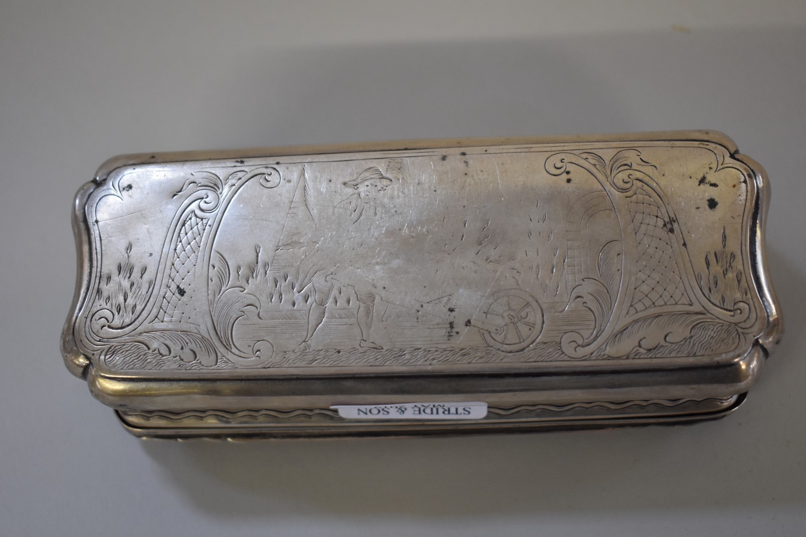 A Dutch white metal tobacco box, having pastoral scenes to both sides, 14cm wide. - Image 5 of 5