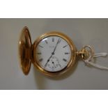 An Elgin gold plated hunter pocket watch, having engine turned case enclosing a 33mm signed white