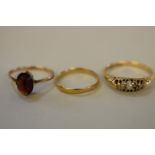 A gold wedding band, stamped 22ct, 1.1g; together with a gold gypsy ring, stamped 18ct, 2.9g; and
