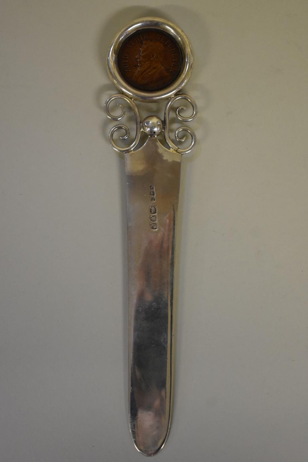 A Victorian silver paper knife,Â by A Barratt & Sons, Piccadilly, London 1900, inset 1898 South