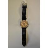 A 1950s Doxa stainless steel triple calendar chronograph wristwatch, having gilt dial, manual