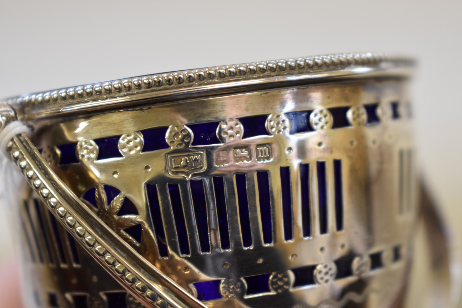 A pierced silver sugar basket,Â by L & W, Birmingham 1911, 11cm high, 99g. - Image 2 of 2