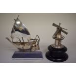 A model of a Greek sailboat, stamped sterling 925; together with model windmill on wooden plinth.