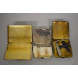 Three silver cigarette cases, 303g.