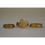 Two gold wedding bands and a gentleman's gold signet ring, hallmarked 375, 7.5g.