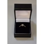An unmarked solitaire brilliant cut diamond ring, approximately .32ct