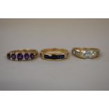 Three various gem set gold rings, stamped 375.