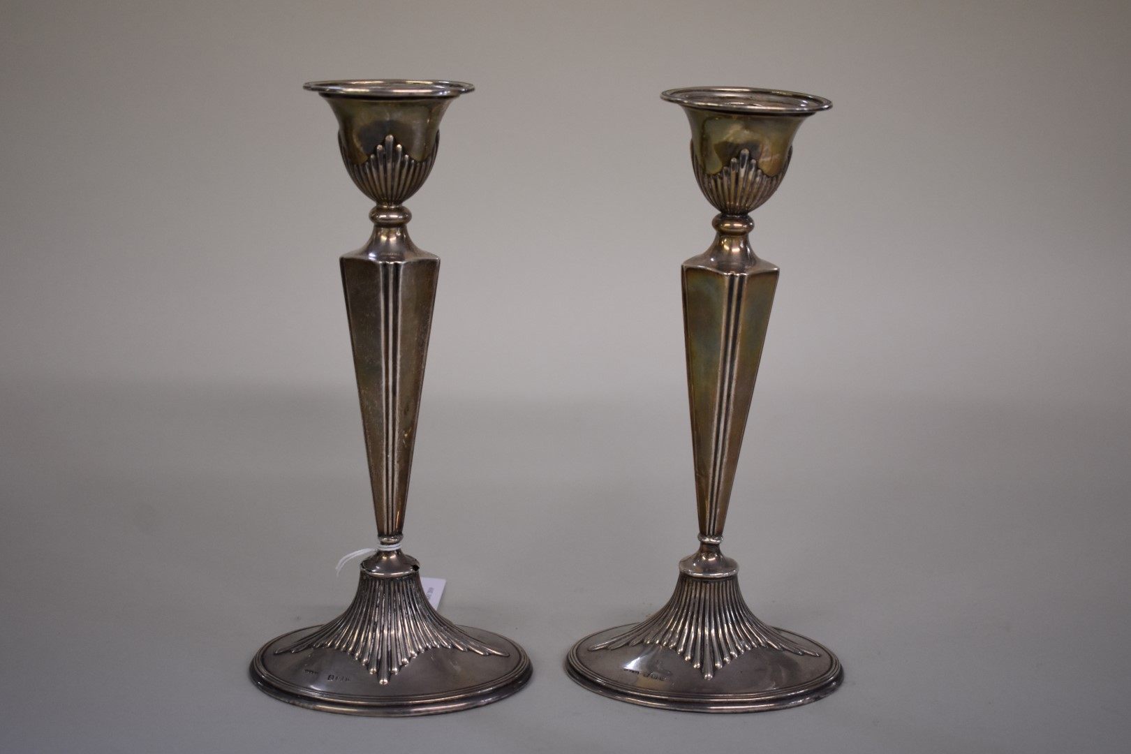 A pair of silver candlesticks,Â by Cornelius Desormeaux Saunders & James Francis Hollings,Â