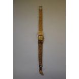 An Omega 9ct gold ladies manual wind bracelet watch, cal 485, serial number 28632255, 26g.