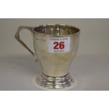 A silver Christening mug, by E F Braham Ltd, Birmingham 1947, 8.5cm high, 102g.