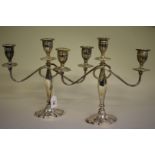 A pair of silver twin branch candelabra,Â by Alexander Smith,Â Birmingham 1976, 27.5cm high.