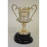 An Edwardian silver twin handled trophy cup, by Joseph Lester Ltd, Birmingham 1910, 13cm high, 101.