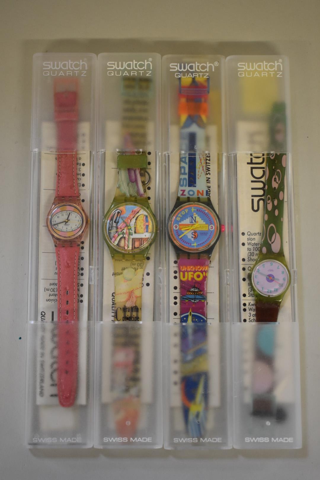 Four various boxed Swatch wristwatches, Lp 115, Photo shooting, Gym Sessions and Nueni.