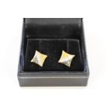 A pair of pave set triple coloured diamond gold ear studs, stamped 18k.