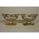 A pair of George III silver pedestal salts, by Robert & Samuel Hennell, London 1805, 5.56cm x 9.5cm,