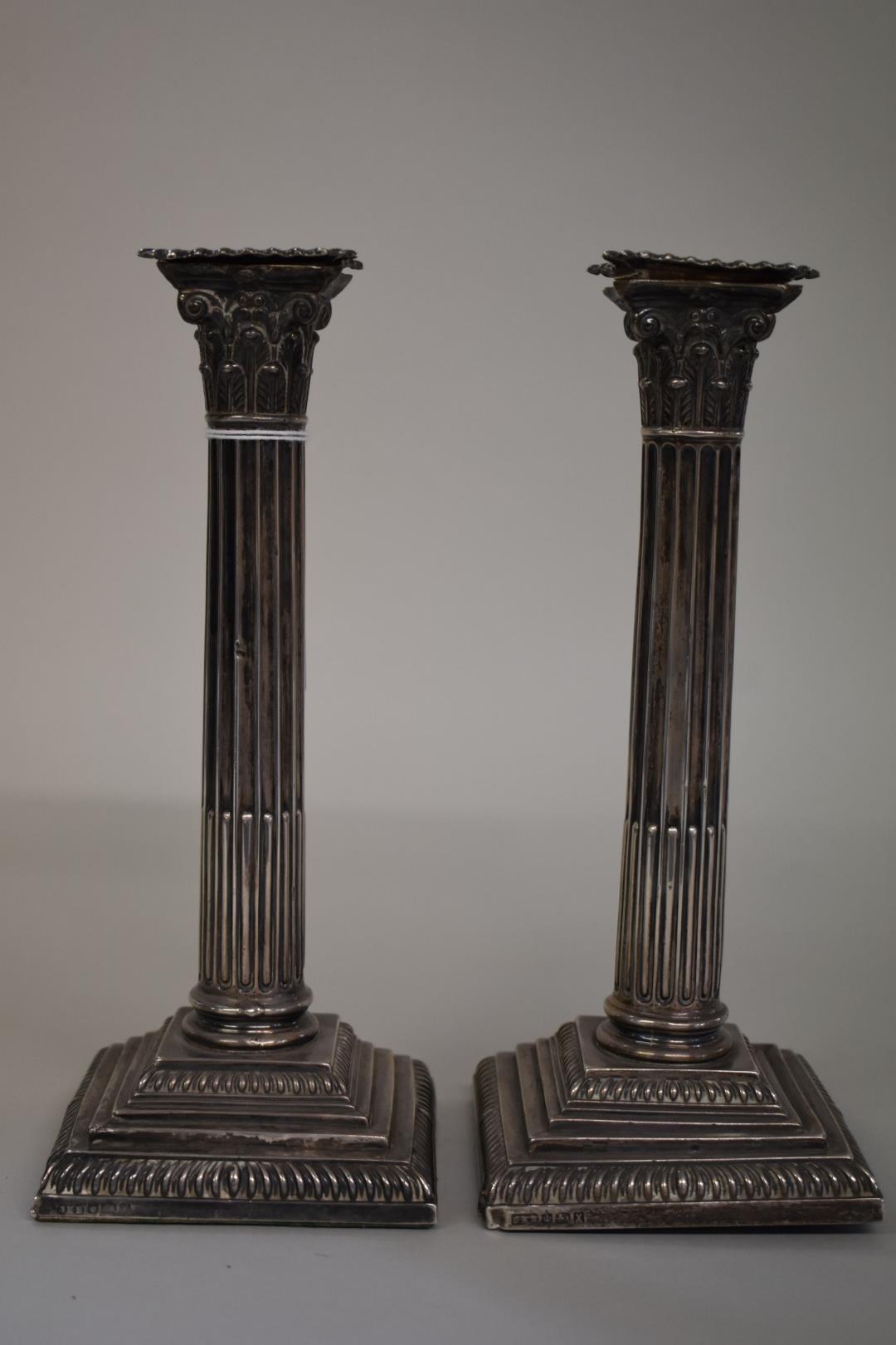 A pair of Victorian silver Corinthian column candlesticks,Â byÂ Hawksworth, Eyre & Co Ltd,Â