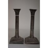 A pair of Victorian silver Corinthian column candlesticks,Â byÂ Hawksworth, Eyre & Co Ltd,Â