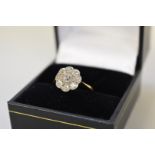 A diamond 'Daisy' cluster gold ring, stamped 18ct.