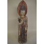 A Sino-Tibetan carved and polychrome painted wood figure, 74cm high.