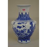 A Chinese blue and white twin handled vase, Kangxi six character mark, painted with a phoenix and