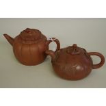 Two Chinese yixing melon form teapots and covers, late Qing, one with seal mark to base, largest