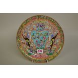 A Chinese famille rose plate, painted with a vase and two exotic birds, 25cm diameter.