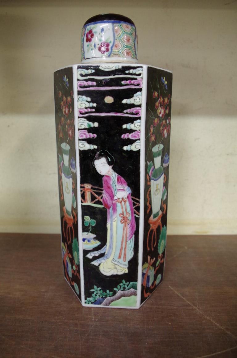 A famille rose black ground hexagonal vase and cover, probably Japanese, 29cm high.