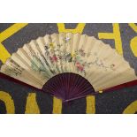 A large Chinese watercolour painted fan, decorated with birds in a landscape, signed, the guards,