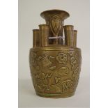 A Chinese bronze crocus or bulb vase, moulded in relief with precious objects, 12cm high.