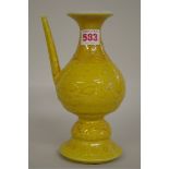 A ChineseÂ yellow glaze holy water vessel,Â Xuande six character mark,Â decorated with a five clawed