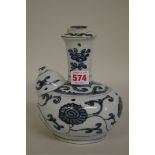 A Chinese blue and white kendi, late Ming, 18cm high, (repair to rim).