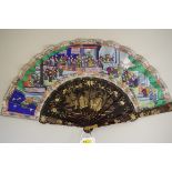 A Chinese lacquer and watercolour painted fan, with applied ivory faces, the guards 28cm long, in